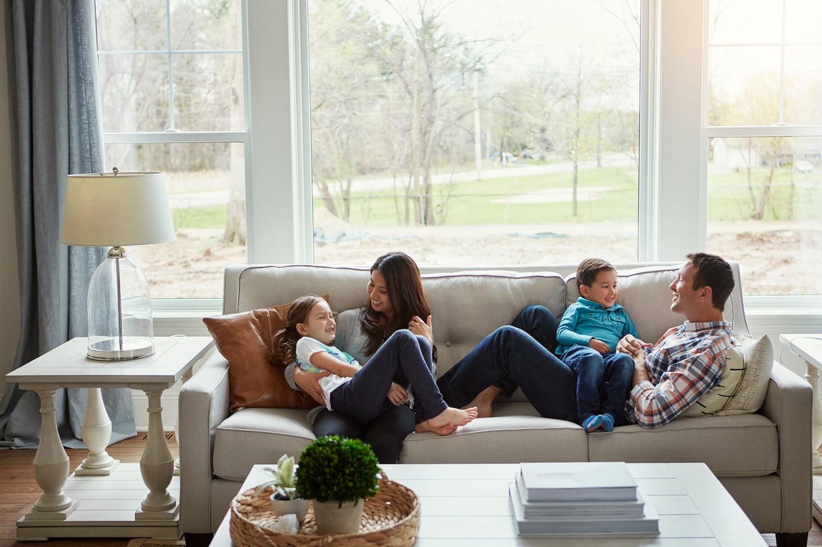 Happy family relaxing together in a warm, inviting living room